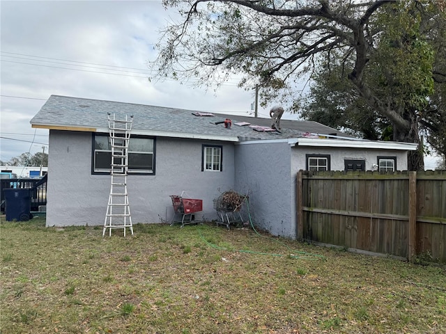 back of house with a yard