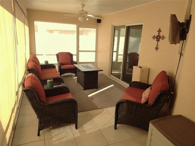 sunroom / solarium featuring ceiling fan