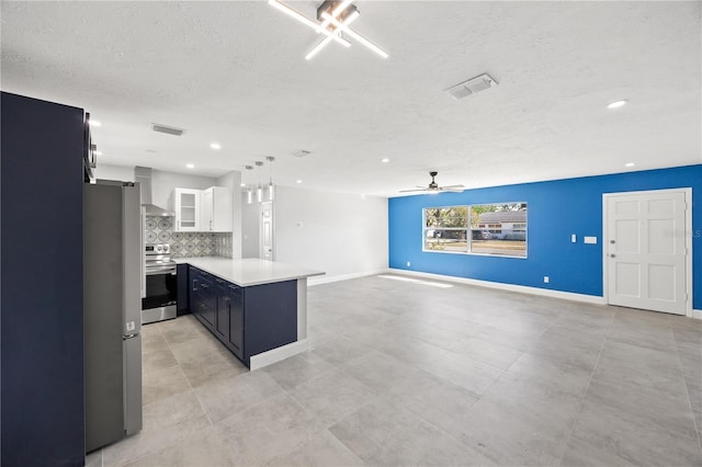 kitchen featuring backsplash, stainless steel appliances, white cabinets, kitchen peninsula, and wall chimney exhaust hood