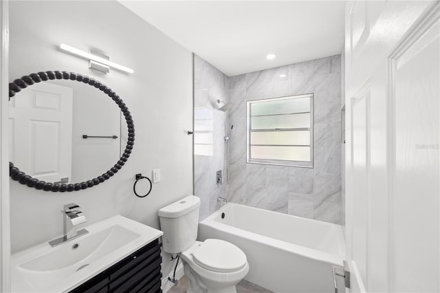 full bathroom with vanity, toilet, and tiled shower / bath combo