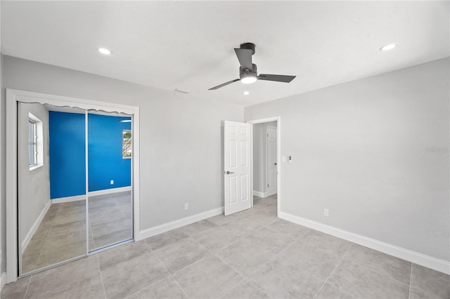 unfurnished bedroom featuring ceiling fan