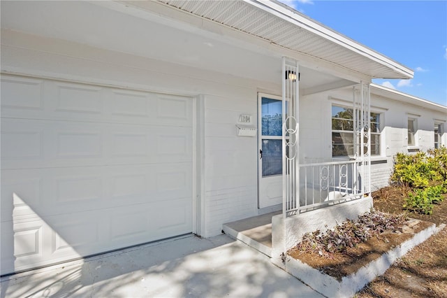 view of exterior entry with a porch