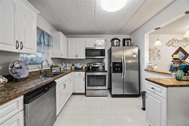 kitchen with stainless steel appliances and white cabinets