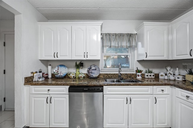 kitchen featuring white cabinets, a textured ceiling, sink, and dishwasher