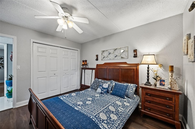 bedroom featuring a textured ceiling, dark hardwood / wood-style flooring, and a closet