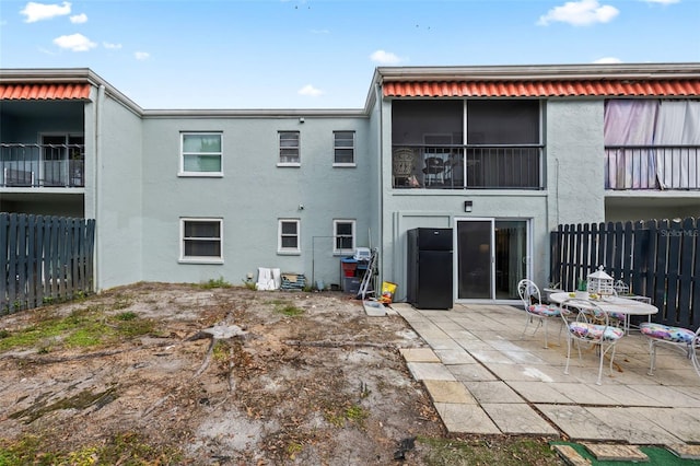 rear view of house featuring a patio area