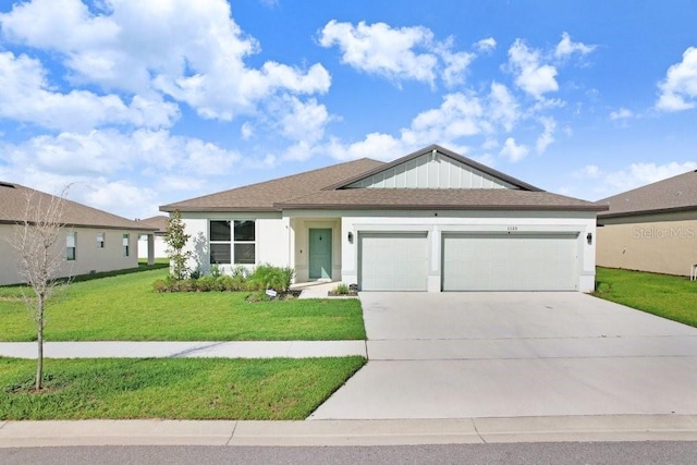 single story home featuring a garage and a front yard