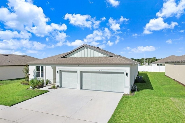 single story home with a garage and a front yard