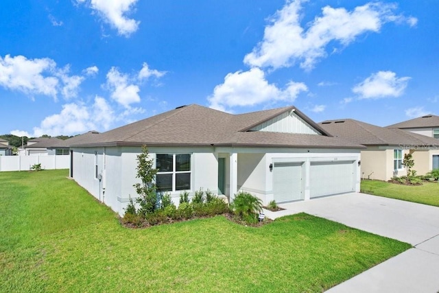 view of front of property with a garage and a front yard