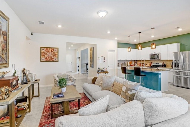 living room featuring sink