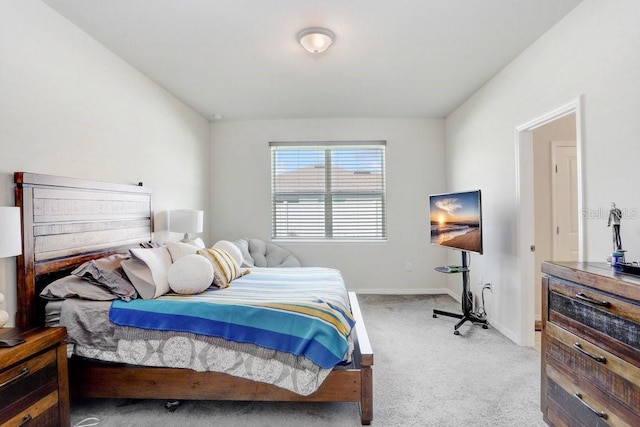 bedroom featuring light colored carpet