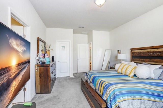 bedroom featuring light colored carpet