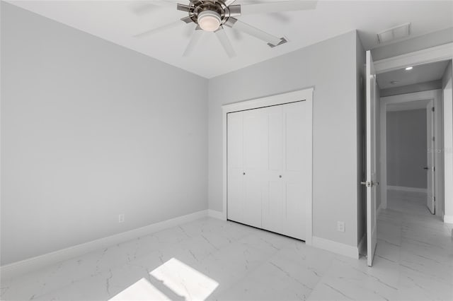 unfurnished bedroom with a closet and ceiling fan