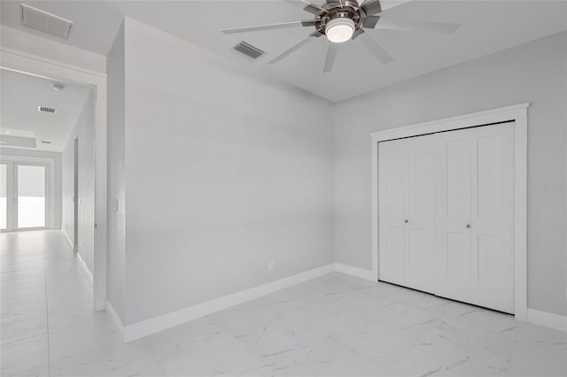 unfurnished bedroom with a closet and ceiling fan