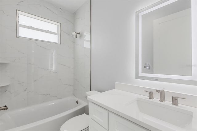 full bathroom with vanity, toilet, and tiled shower / bath combo