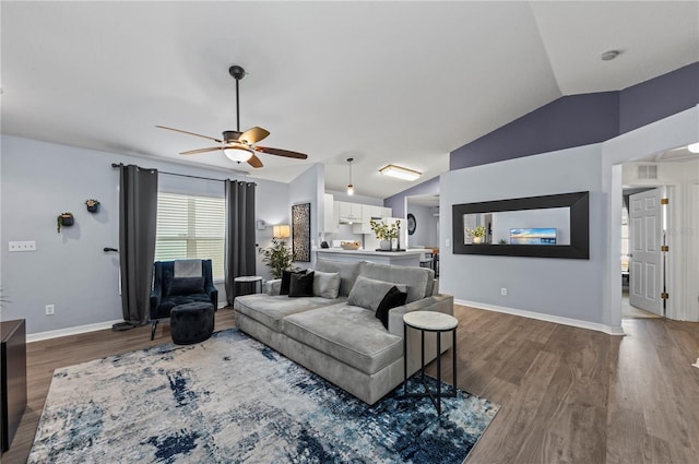 living room with vaulted ceiling, dark wood-type flooring, and ceiling fan