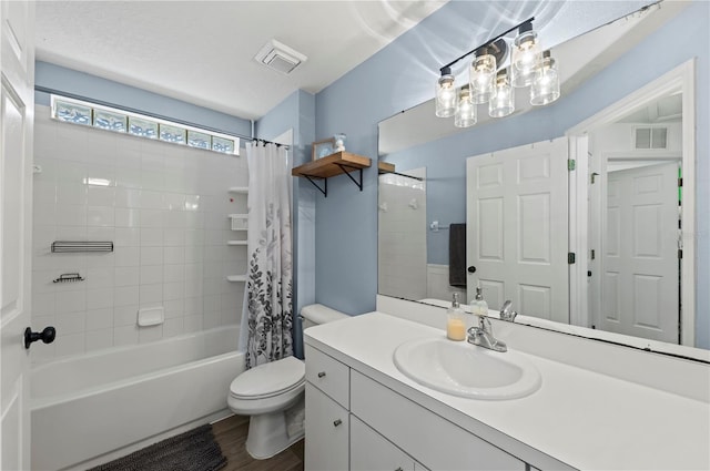 full bathroom with vanity, wood-type flooring, shower / bathtub combination with curtain, and toilet