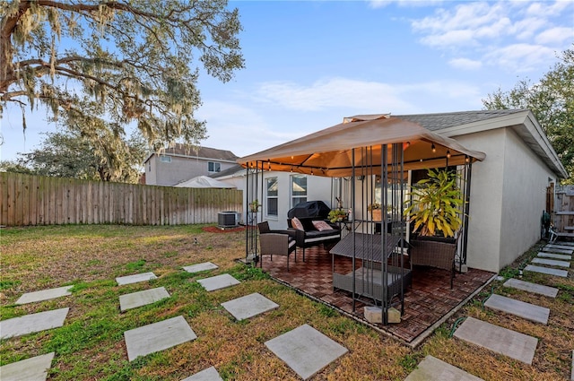 view of patio / terrace featuring cooling unit and a gazebo