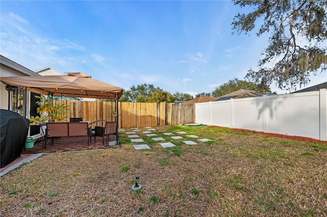 view of yard with a gazebo and a patio