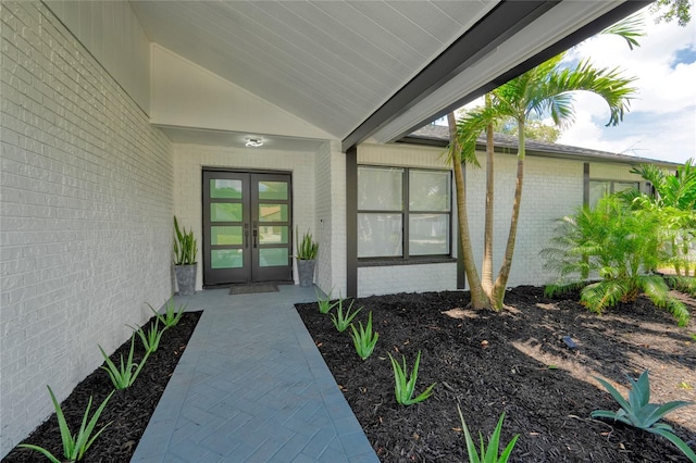 view of exterior entry featuring french doors