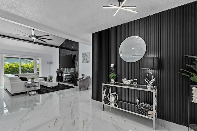 living room with lofted ceiling, ceiling fan, and a textured ceiling