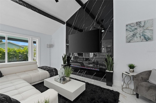 living room with lofted ceiling with beams and a textured ceiling