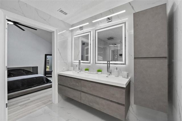 bathroom featuring vanity and ceiling fan