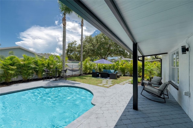 view of pool with outdoor lounge area and a patio area