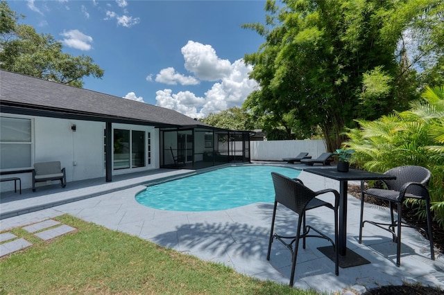 view of pool with a lanai and a patio area