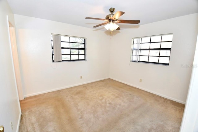 carpeted empty room with ceiling fan