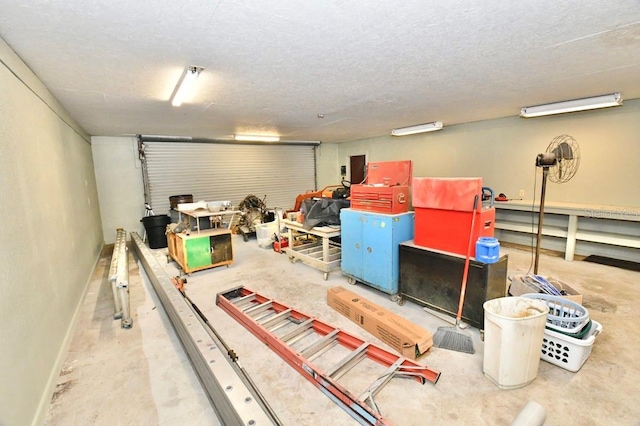 basement featuring a textured ceiling