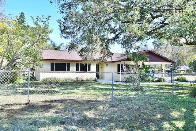 ranch-style home with a front lawn