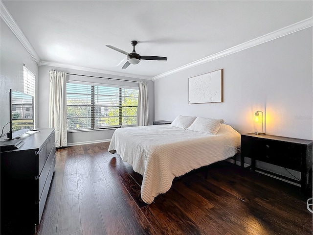 bedroom featuring crown molding, ceiling fan, and dark wood-type flooring