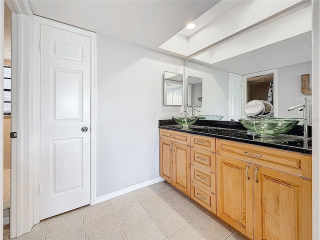 bathroom with vanity and tile patterned flooring