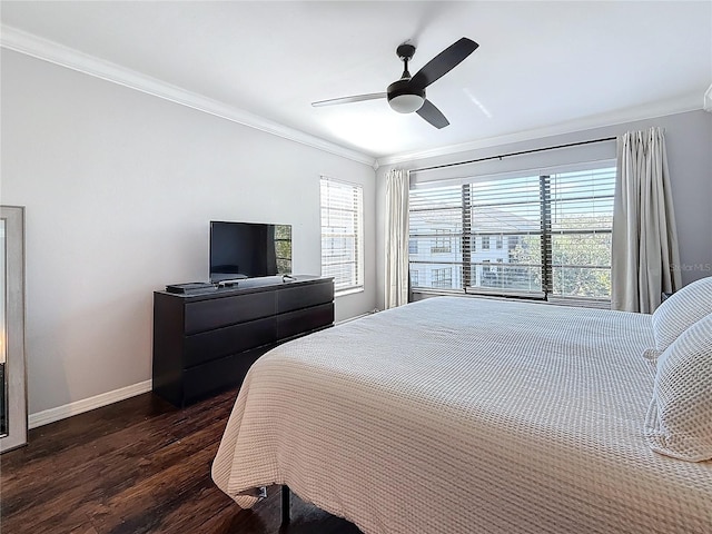bedroom with crown molding, baseboards, dark wood finished floors, and ceiling fan