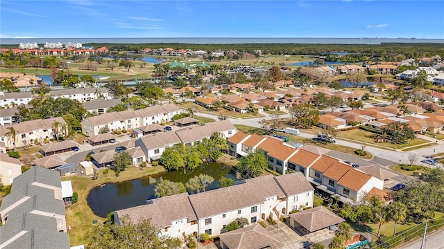 aerial perspective of suburban area featuring a nearby body of water