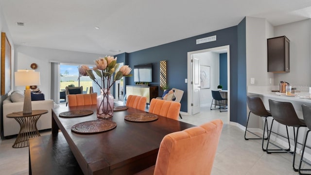 dining space with light tile patterned floors