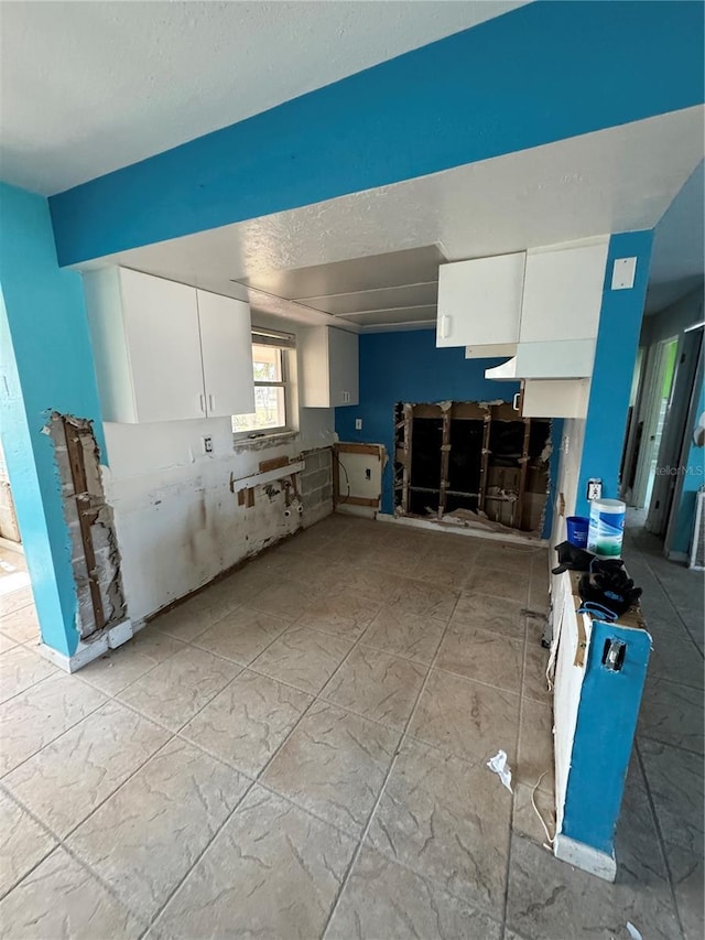 kitchen featuring white cabinets