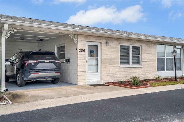 view of front of home with a carport