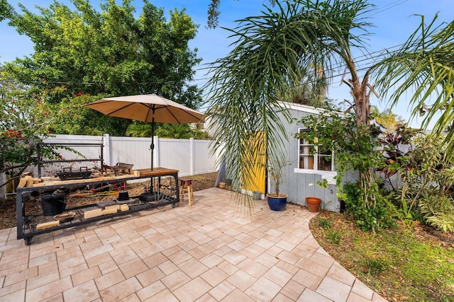 view of patio with an outdoor structure