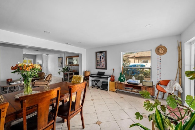 tiled dining area featuring plenty of natural light