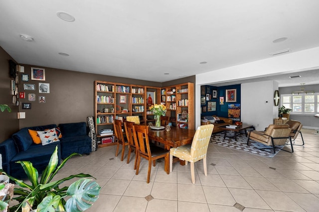 dining space featuring light tile patterned floors