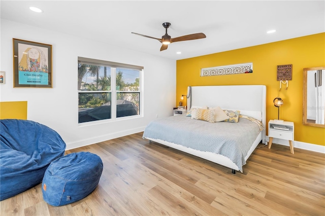 bedroom with baseboards, recessed lighting, and wood finished floors