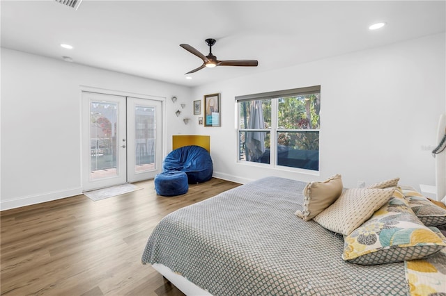 bedroom with french doors, recessed lighting, access to outside, and wood finished floors