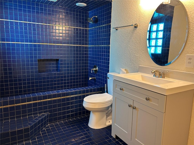 full bathroom with tile patterned floors, vanity, toilet, and tiled shower / bath