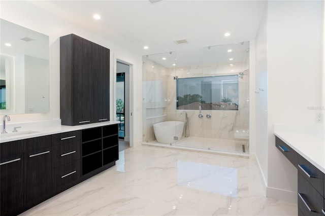 bathroom featuring plus walk in shower and vanity