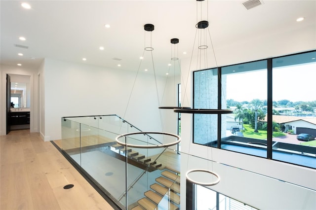 corridor featuring light hardwood / wood-style floors