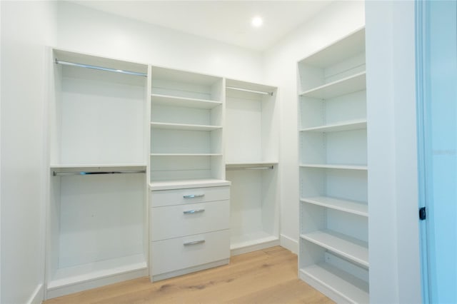 walk in closet featuring light hardwood / wood-style floors