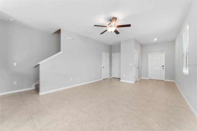 unfurnished living room with ceiling fan