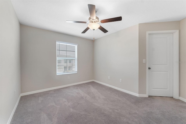 unfurnished room with light carpet and ceiling fan